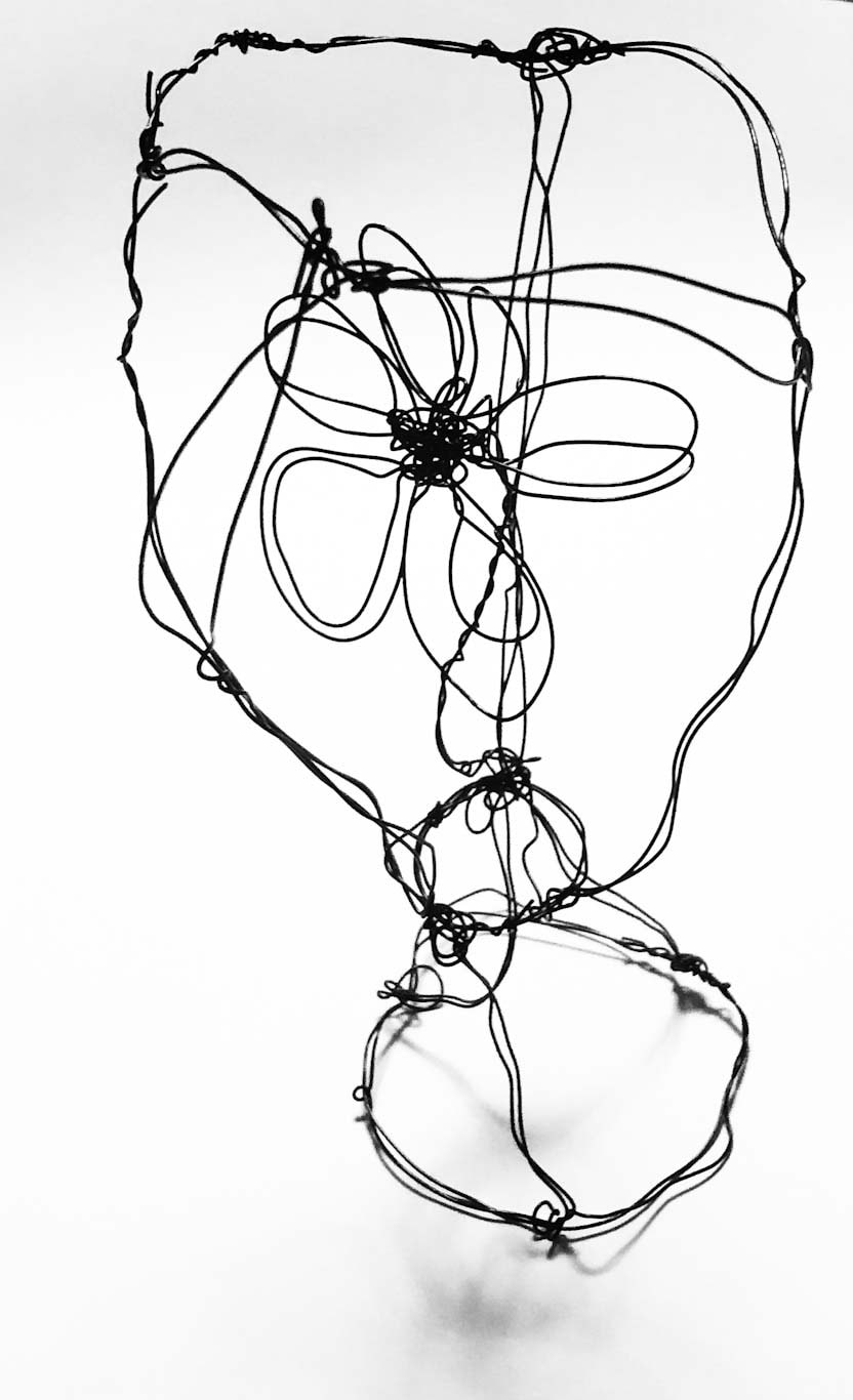wire sculpture of chalice with flower inside